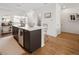 Modern kitchen with white countertops, dark cabinets, and barstool seating at the island for a welcoming and functional space at 5880 W 39Th Pl, Wheat Ridge, CO 80212