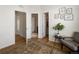 Living room showcasing hardwood floors and hallway access to a bathroom and closet at 5880 W 39Th Pl, Wheat Ridge, CO 80212