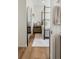 Bedroom view showcasing hardwood floors and a four-poster bed at 5880 W 39Th Pl, Wheat Ridge, CO 80212