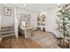 Bright home office space with desk, shelving, and stairs leading to a second floor at 5880 W 39Th Pl, Wheat Ridge, CO 80212