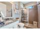 Bathroom featuring granite countertops, glass shower enclosure, and modern fixtures at 5923 S Jamestown Ct, Aurora, CO 80016