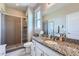 Bathroom featuring granite countertops and a glass shower enclosure at 5923 S Jamestown Ct, Aurora, CO 80016