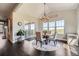 Cozy dining room with a round table, modern light fixture, and sliding door access to the outdoor deck at 5923 S Jamestown Ct, Aurora, CO 80016