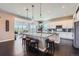 Bright, eat-in kitchen featuring a large center island with barstool seating and pendant lighting at 5923 S Jamestown Ct, Aurora, CO 80016