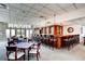 Community bar area with bar seating and tables for residents to gather at 2700 W Riverwalk Cir # C, Littleton, CO 80123