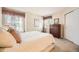 Comfortable bedroom with neutral tones, natural light, and closet, designed for peaceful rest at 2700 W Riverwalk Cir # C, Littleton, CO 80123