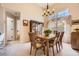 Inviting dining room with natural light, ample seating, and stylish furnishings, ideal for gatherings at 2700 W Riverwalk Cir # C, Littleton, CO 80123