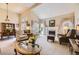 Bright living room features a fireplace, plush seating, and elegant decor, perfect for relaxation at 2700 W Riverwalk Cir # C, Littleton, CO 80123