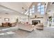 Bright lobby with large windows, elegant fireplace, neutral colored couches, and plenty of seating at 2700 W Riverwalk Cir # C, Littleton, CO 80123