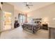 Cozy bedroom with large windows, ceiling fan, and coordinated decor, creating a serene retreat at 2700 W Riverwalk Cir # C, Littleton, CO 80123
