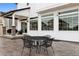 Back patio featuring black metal furniture and white siding at 22025 E 45Th Ave, Aurora, CO 80019