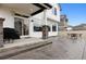 View of a spacious, stamped concrete back patio with seating and a grill, perfect for outdoor entertaining at 22025 E 45Th Ave, Aurora, CO 80019