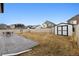 Spacious backyard featuring a large shed, stamped concrete patio, and room for recreation at 22025 E 45Th Ave, Aurora, CO 80019