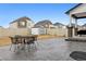Large backyard with a stamped concrete patio, shed, and mature landscaping at 22025 E 45Th Ave, Aurora, CO 80019
