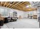 Unfinished basement, ready for customization, with visible beams and natural light at 22025 E 45Th Ave, Aurora, CO 80019