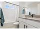 Bright bathroom featuring a bathtub and a modern vanity at 22025 E 45Th Ave, Aurora, CO 80019