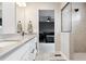 Stylish bathroom with a glass enclosed shower and view to main bedroom at 22025 E 45Th Ave, Aurora, CO 80019