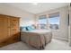 Cozy bedroom with carpet floors, bright windows and wardrobe at 22025 E 45Th Ave, Aurora, CO 80019