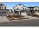 Charming two-story home with stone and siding, a two-car garage and landscaped front yard at 22025 E 45Th Ave, Aurora, CO 80019