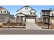 Charming two-story home with a two car garage and landscaped front yard at 22025 E 45Th Ave, Aurora, CO 80019