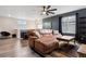 Second-floor living area boasts a comfortable sofa, a decorative rug, and a contemporary design at 22025 E 45Th Ave, Aurora, CO 80019