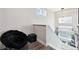 Comfortable loft area with a fluffy chair, staircase and plenty of natural light from large windows at 22025 E 45Th Ave, Aurora, CO 80019