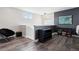 Upstairs loft area with chair, bookshelf, and dark accent wall at 22025 E 45Th Ave, Aurora, CO 80019