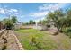 Expansive backyard featuring a well-maintained lawn, garden beds, storage shed, and perimeter fence at 8190 Raleigh Pl, Westminster, CO 80031
