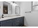 Modern bathroom with double vanity, sleek mirrors, and updated fixtures at 8190 Raleigh Pl, Westminster, CO 80031