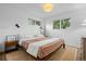 Cozy bedroom with natural light, hardwood floors, and modern light fixtures at 8190 Raleigh Pl, Westminster, CO 80031