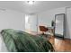 Bedroom featuring modern desk, chair, and full length mirror at 8190 Raleigh Pl, Westminster, CO 80031