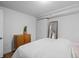 Bright bedroom featuring full length mirror and hardwood floors at 8190 Raleigh Pl, Westminster, CO 80031