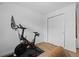 This bedroom features hardwood floors, a peloton and a double-door closet at 8190 Raleigh Pl, Westminster, CO 80031