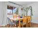 Cozy dining area featuring a wooden table, comfortable seating, and natural light at 8190 Raleigh Pl, Westminster, CO 80031
