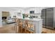 Bright kitchen featuring stainless steel appliances, white cabinetry, and an island with seating at 8190 Raleigh Pl, Westminster, CO 80031