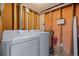 Unfinished laundry room with full size washer and dryer at 8190 Raleigh Pl, Westminster, CO 80031