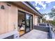 View of a private balcony with gray tile and access to the living room through sliding glass doors at 2010 Pearl St # B, Boulder, CO 80302