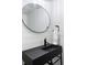 Modern bathroom with sleek black sink, round mirror, and stylish fixtures at 2010 Pearl St # B, Boulder, CO 80302