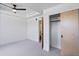 Well-lit bedroom with ceiling fan, en-suite bathroom, and closet at 2010 Pearl St # B, Boulder, CO 80302