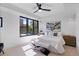 Bright bedroom features a large window, ceiling fan, and neutral decor at 2010 Pearl St # B, Boulder, CO 80302