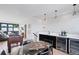 An entertainment area featuring a foosball table, wet bar, dining area, and access to the open-concept living area at 2010 Pearl St # B, Boulder, CO 80302