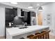 Well-equipped kitchen with stainless steel appliances, a large island, and sleek dark cabinetry at 2010 Pearl St # B, Boulder, CO 80302