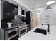 Well-equipped kitchen featuring stainless steel appliances, dark backsplash, and a large white countertop island at 2010 Pearl St # B, Boulder, CO 80302