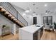 Stylish kitchen with floating staircase, a large island, stainless steel appliances, and modern pendant lighting at 2010 Pearl St # B, Boulder, CO 80302