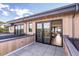 Exterior view of the outdoor patio with a mountain view, dining set, and a view of the open-concept living area at 2010 Pearl St # B, Boulder, CO 80302