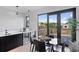 Outdoor patio with mountain view, a dining set, and access to the kitchen bar area and open-concept layout at 2010 Pearl St # B, Boulder, CO 80302