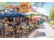 Vibrant outdoor seating at Centro Mexican Kitchen, featuring colorful umbrellas and flower-filled planters at 2010 Pearl St # B, Boulder, CO 80302