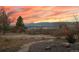 Landscaped backyard featuring decorative rocks and gravel, ideal for outdoor enjoyment at 265 Ox Yoke Way, Monument, CO 80132