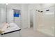 Bright bathroom featuring walk-in shower and double sinks with blue accents at 265 Ox Yoke Way, Monument, CO 80132