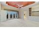 Primary bedroom features a ceiling fan, private deck access, and en-suite bathroom at 265 Ox Yoke Way, Monument, CO 80132